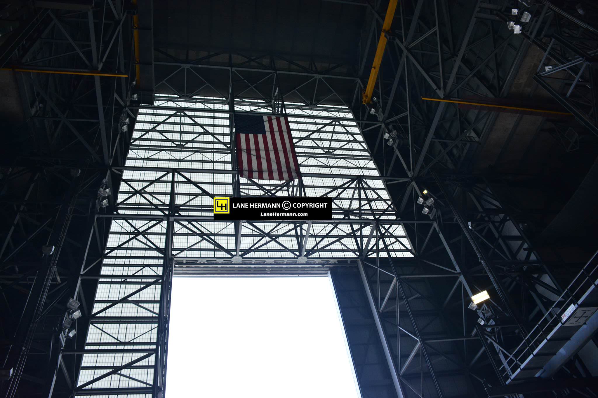 US Flag hangs proudly inside the VAB - America’s Premier Spaceport to Deep Space.  Credit: Lane Hermann 