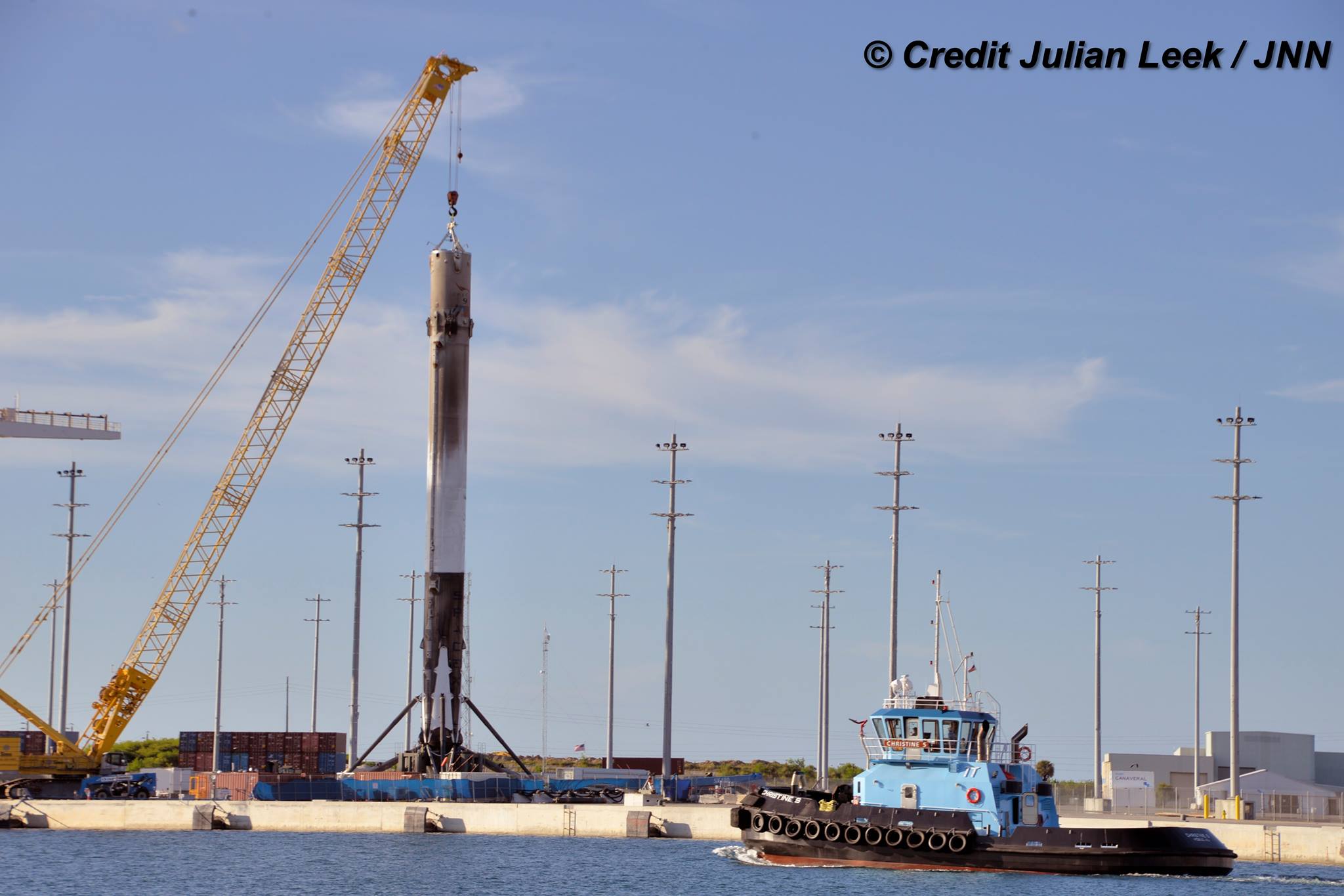 Recovered SpaceX Falcon 9 booster from JCSAT-16 launch after arrival in Port Canaveral, FL on Aug. 17, 2016 with landing legs deployed. Credit: Julian Leek