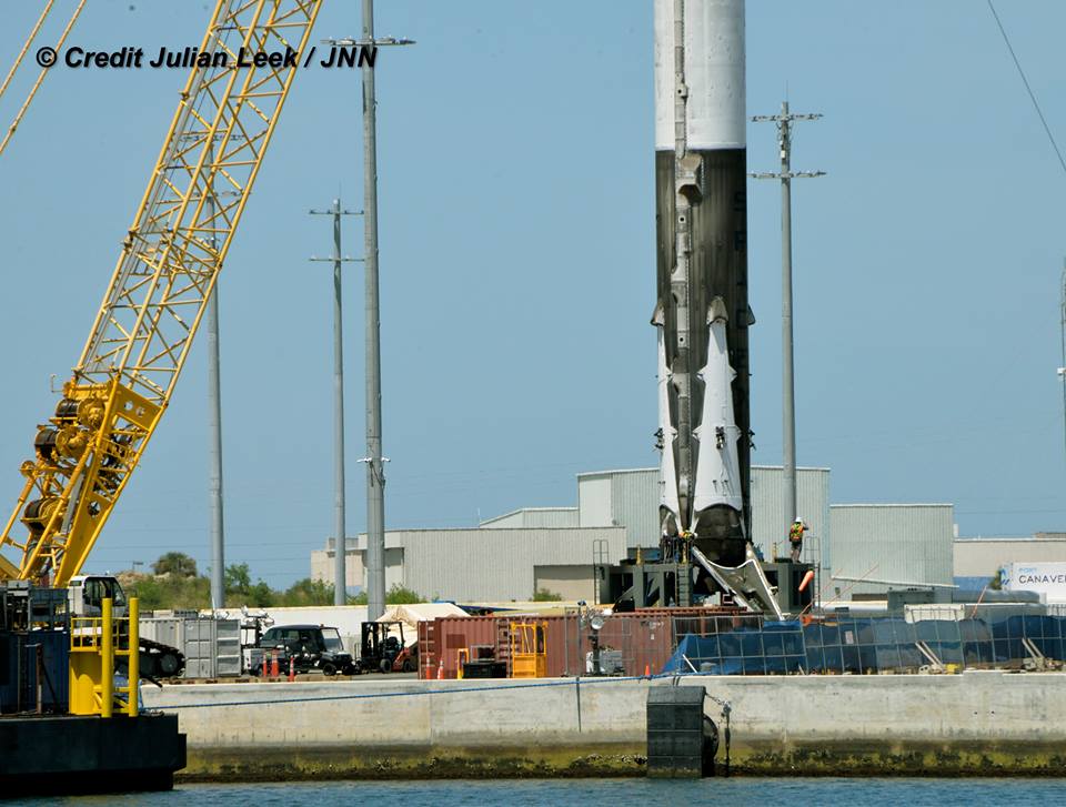 Recovered SpaceX Falcon 9 booster from JCSAT-16 launch after arrival in Port Canaveral, FL on Aug. 17, 2016 after 3 landing legs removed. Credit: Julian Leek 