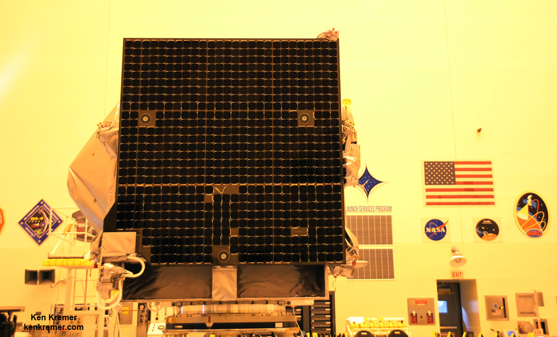 Side view of NASA’s OSIRIS-Rex asteroid sampling spacecraft showing the High Gain Antenna at left and solar panel, inside the Payloads Hazardous Servicing Facility high bay at NASA's Kennedy Space Center.  Probe is being processed for Sep. 8, 2016 launch to asteroid Bennu from Cape Canaveral Air Force Station, FL.  Credit: Ken Kremer/kenkremer.com