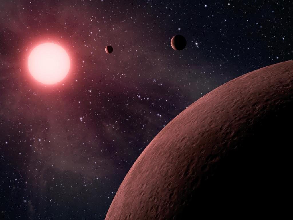 Artist's impression of a system of exoplanets orbiting a low mass, red dwarf star. Since magma ocean planets are more difficult to detect around red dwarfs, the number of red dwarfs in each Young Moving Group affects the probability of finding magma ocean planets in those groups. Credit: NASA/JPL