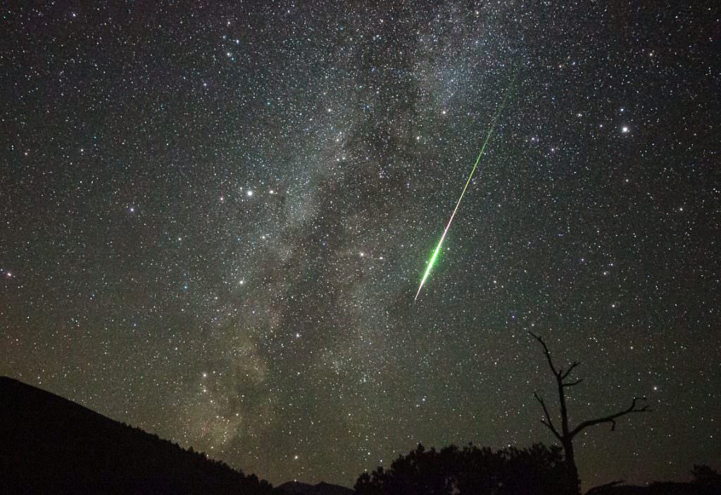 A brilliant Perseid meteor streaks along the Summer Milky Way as seen from Cinder Hills Overlook at Sunset Crater National Monument—12 August 2016 2:40 AM (0940 UT). It left a glowing ion trail that lasted about 30 seconds. The camera caught a twisting smoke trail that drifted southward over the course of several minutes.