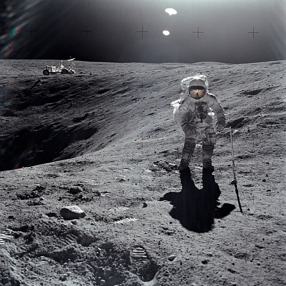 Sample collection on the surface of the Moon. Apollo 16 astronaut Charles M. Duke Jr. is shown collecting samples with the Lunar Roving Vehicle in the left background. Image: NASA