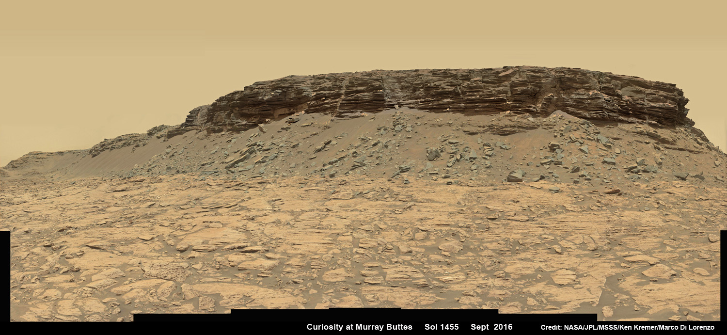 Wide angle mosaic view shows spectacular buttes and layered sandstone in the Murray Buttes region on lower Mount Sharp from the Mastcam cameras on NASA's Curiosity Mars rover.  This photo mosaic was assembled from Mastcam color camera raw images taken on Sol 1455, Sept. 9, 2016 and stitched by Marco Di Lorenzo and Ken Kremer, with added artificial sky.  Credit: NASA/JPL/MSSS/Ken Kremer/kenkremer.com/Marco Di Lorenzo