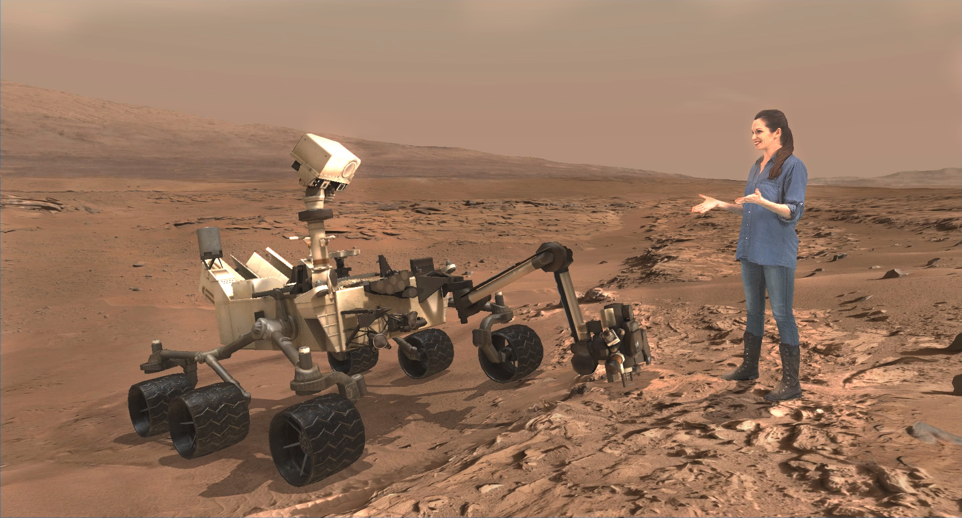 A scene from ‘Destination Mars’ of Erisa Hines and  NASA’s Curiosity Mars rover with Mount Sharp Gale crater rim in the distance. The new, limited time interactive exhibit is now showing at the Kennedy Space Center visitor complex in Florida through Jan 1, 2017. Credit: NASA/JPL/Microsoft 