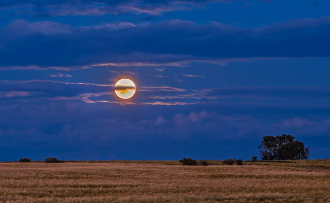 The Full Moon of August 18, 2016 - the “Sturgeon Moon” - rising amid cloud over a wheatfield. This is a 5-exposure stack blended with luminosity masks, and shot with the Canon 60Da and 135mm telephoto.