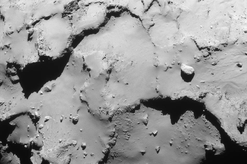 Rosetta's last navigation camera image was taken just after the collision maneuver sequence Thursday evening (CDT) when the probe was 9.56 miles (15.4 km) above the comet's surface. Credit: ESA/Rosetta