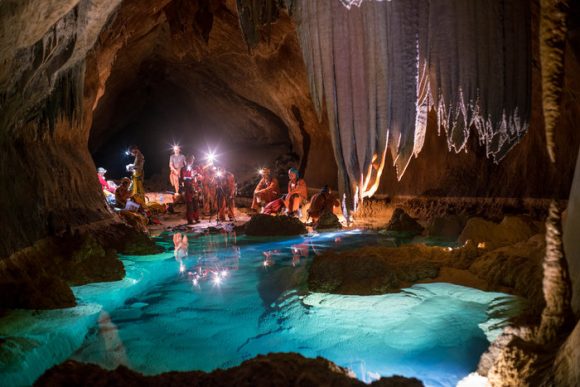 The six-member CAVES team in Sardinia, Italy, observing an underground pool. Credit: ESA/V.Crobu