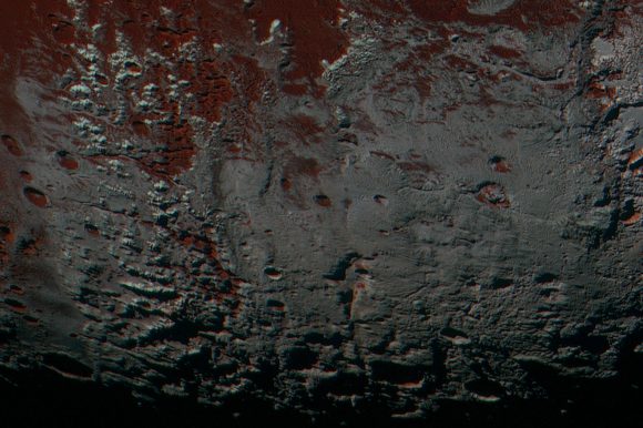 This area is south of Pluto's dark equatorial band informally named Cthulhu Regio, and southwest of the vast nitrogen ice plains informally named Sputnik Planitia. North is at the top; in the western portion of the image, a chain of bright mountains extends north into Cthulhu Regio. New Horizons compositional data indicate the bright snowcap material covering these mountains isn't water, but atmospheric methane that has condensed as frost onto these surfaces at high elevation. Between some mountains are sharply cut valleys – indicated by the white arrows. These valleys are each a few miles across and tens of miles long. Credit: NASA/Johns Hopkins University Applied Physics Laboratory/Southwest Research Institute. 