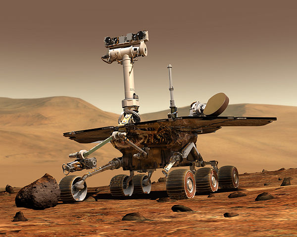 An artist's conception of Spirit/Opportunity working on Mars. By NASA/JPL/Cornell University, Maas Digital LLC - http://photojournal.jpl.nasa.gov/catalog/PIA04413 (image link), Public Domain, https://commons.wikimedia.org/w/index.php?curid=565283