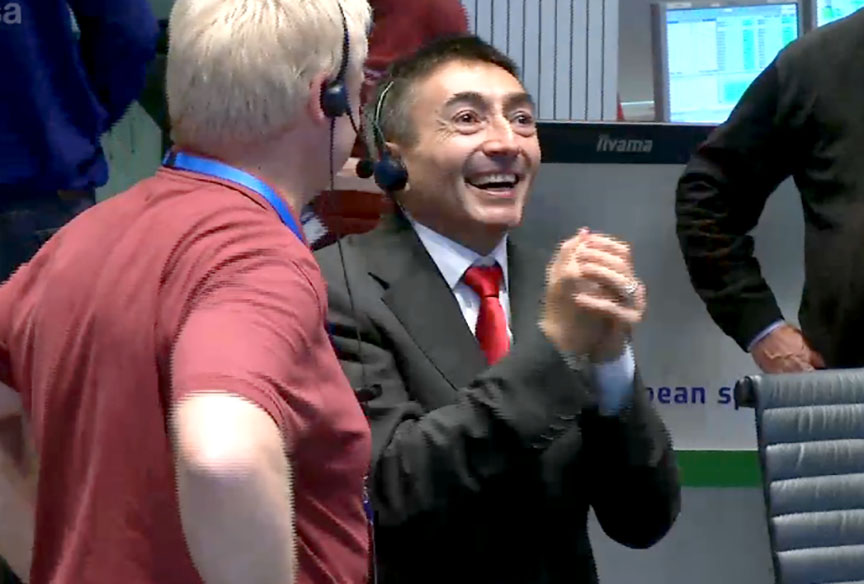 Hugs in the control room when the signal from the Trace Gas Orbiter was received this morning, signaling that the spacecraft had achieved orbit around Mars. Credit: ESA Livestream