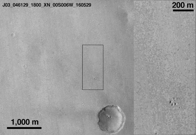 Mars Reconnaissance Orbiter view of Schiaparelli landing site before and after the lander arrived. The images have a resolution of 6 meters per pixel and shows two new features on the surface when compared to an image from the same camera taken in May this year. The black dot appears to be the lander impact site and the smaller white dot below the paw-shaped cluster of craters, the parachute. Credit: NASA