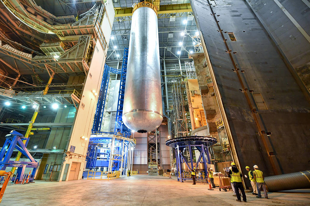 Welding is complete on the largest piece of the core stage that will provide the fuel for the first flight of NASA's new rocket, the Space Launch System, with the Orion spacecraft in 2018. The core stage liquid hydrogen tank has completed welding on the Vertical Assembly Center at NASA's Michoud Assembly Facility in New Orleans.  Credit: NASA/MAF/Steven Seipel
