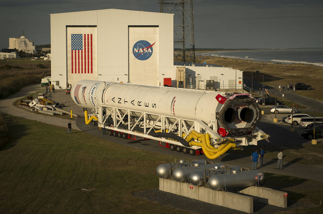 The Orbital ATK Antares rocket, with the Cygnus spacecraft onboard, is rolled out of the Horizontal Integration Facility (HIF) to begin the approximately half-mile journey to launch Pad-0A, Thursday, Oct. 13, 2016 at NASA's Wallops Flight Facility in Virginia. Orbital ATK’s sixth contracted cargo resupply mission with NASA to the International Space Station.  Credit: (NASA/Bill Ingalls)