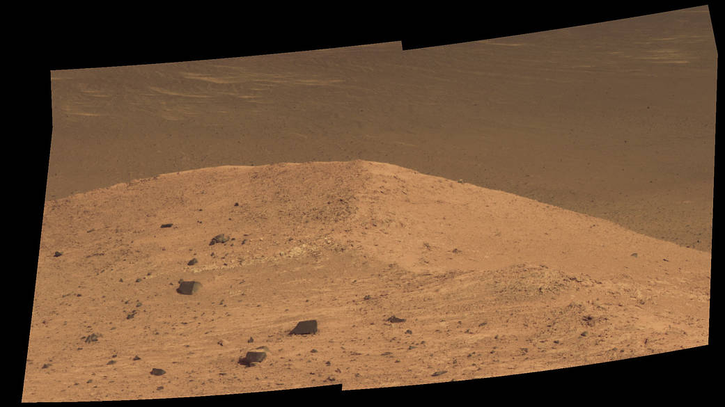 This scene from the panoramic camera (Pancam) on NASA's Mars Exploration Rover Opportunity shows "Spirit Mound" overlooking the floor of Endeavour Crater. The mound stands near the eastern end of "Bitterroot Valley" on the western rim of the crater, and this view faces eastward. The component images for this mosaic were taken on Sept. 21, 2016, during the 4,501st Martian day, or sol, of Opportunity's work on Mars. Credit: NASA/JPL-Caltech/Cornell/Arizona State Univ.