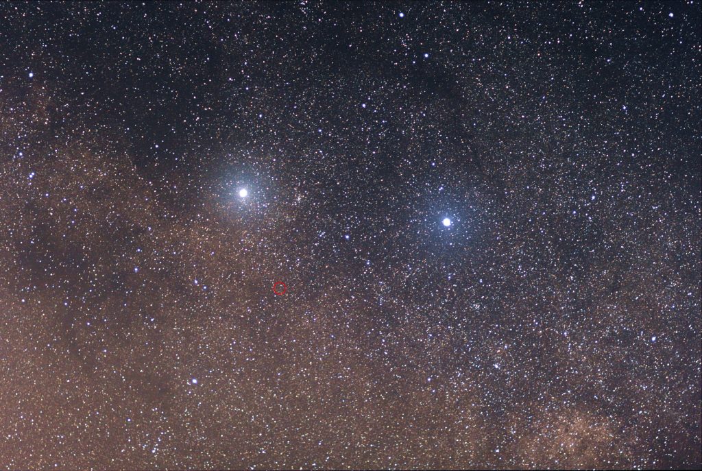 Our closest stellar neighbour is Proxima Centauri, a red dwarf shown in the small red circle. It's too dim for the naked eye to see, but astronomers still detected three planets orbiting it. One of them is an Earth-sized planet in the red dwarf's habitable zone. The two bright stars are (left) Alpha Centauri and (right) Beta Centauri. Credit: Skatebiker at English Wikipedia (CC BY-SA 3.0)