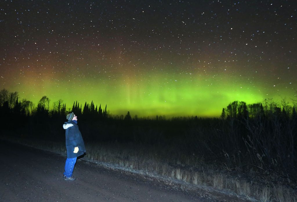The author enjoys a pretty display of the northern lights on October 23 under a starry sky. His new book, "Night Sky with the Naked Eye," explores all the amazing things you can see in the sky without special equipment including satellites, planets, meteor showers and of course, the aurora.