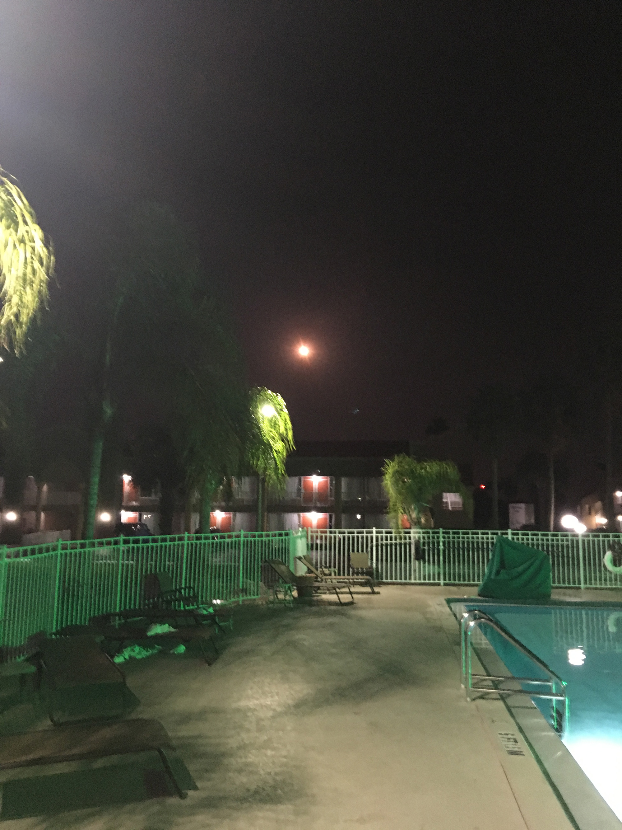 Atlas V rocket and GOES-R nighttime launch soars over the swimming pool at the Quality Inn Kennedy Space Center in Titusville, Florida  on Nov. 19, 2016. Credit: Wesley Baskin