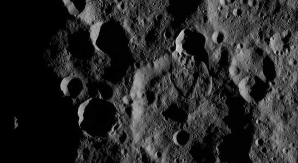 This view from NASA's Dawn spacecraft features a lobe-shaped flow feature in Ghanan Crater on Ceres. The flow feature is a place where a crater rim has collapse and material has flowed across the surface. Several small craters are visible on top of the flow; the number of craters can help scientists estimate the feature's age. Credit: NASA/JPL-Caltech/UCLA/MPS/DLR/IDA
