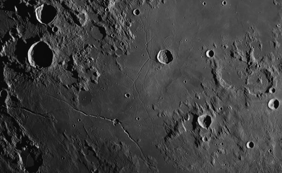Triesnecker crater in the central part of the Moon's near side is 26 km in diameter and 2.7 km deep. A system of rilles can also be seen. Credit and copyright: Thierry Legault. Used by permission. 