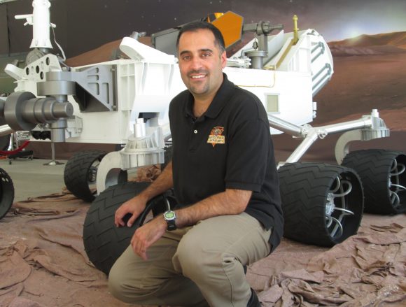 MSL project scientist Ashwin Vasavada with a full scale model of the Curiosity rover. Credit: NASA/JPL.  