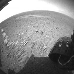 This image shows a close-up of track marks left by the Curiosity rover. Holes in the rover's wheels, seen here in this view, leave imprints in the tracks that can be used to help the rover drive more accurately. The imprint is Morse code for ‘JPL,’ and aids in tracking how far the rover has traveled. Credit: NASA/JPL-Caltech.
