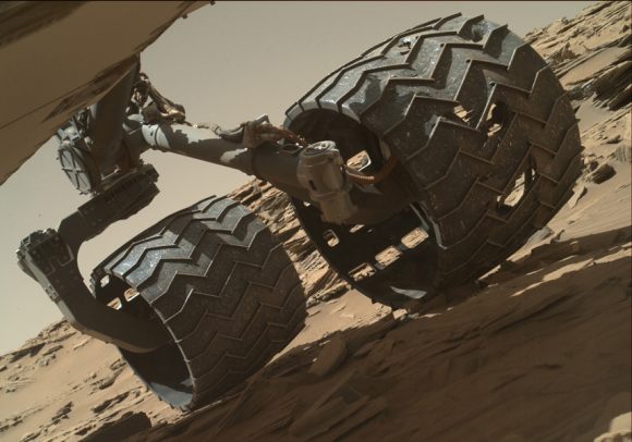 The team operating the Curiosity Mars rover uses the Mars Hand Lens Imager (MAHLI) camera on the rover's arm to check the condition of the wheels at routine intervals. This image of Curiosity's left-middle and left-rear wheels is part of an inspection set taken on April 18, 2016, during the 1,315th sol of the rover's work on Mars. Credit: NASA/JPL-Caltech/MSSS.