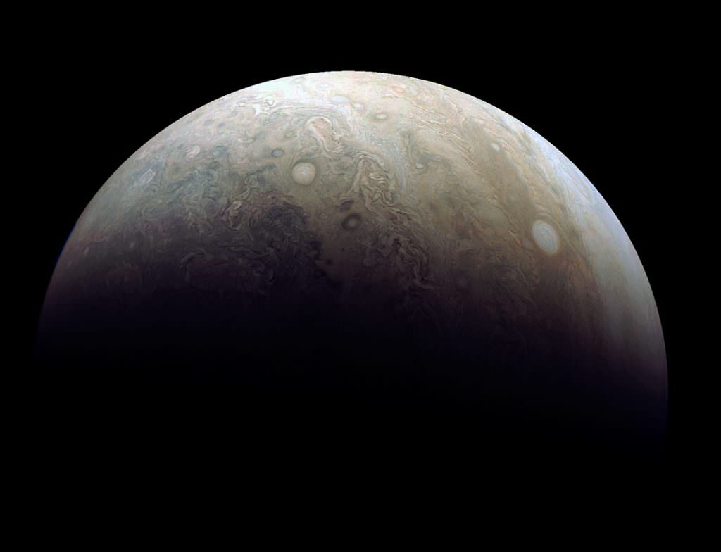 Damian Peach reprocessed one of the latest images taken by Juno's JunoCam during its 3rd close flyby of the planet on Dec. 11. The photo highlights two large 'pearls' or storms in Jupiter's atmosphere. Credit: NASA/JPL-Caltech/SwRI/MSSS