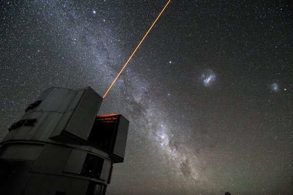 A laser beam launched from VLT´s 8.2-metre Yepun telescope crosses the majestic southern sky and creates an artificial star at 90 km altitude in the high Earth´s mesosphere. The Laser Guide Star (LGS) is part of the VLT´s Adaptive Optics system and it is used as reference to correct images from the blurring effect of the atmosphere. The picture field is crossed by an impressive Milky Way, our own galaxy seen perfectly edge-on. The most prominent objects on the Milky Way are: Sirius, the brightest star in the sky, visible at the top and the Carina nebula, seen as a bright patch besides the telescope. From the right edge of the picture to the left, the following objects are aligned: the Small Magellanic Cloud (with the globular cluster 47 Tucanae on its right), the Large Magellanic Cloud and Canopus, the second brightest star in the sky.