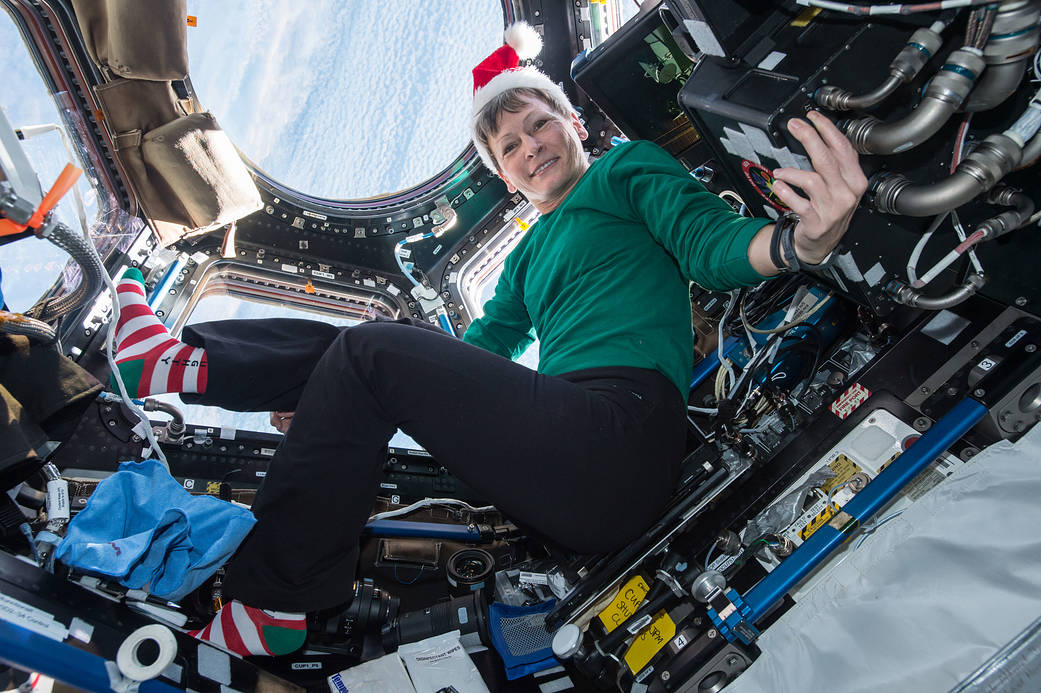 Aboard the International Space Station, Expedition 50 Flight Engineer Peggy Whitson of NASA sent holiday greetings and festive imagery from the cupola on Dec. 18, 2016. Credit: NASA. 