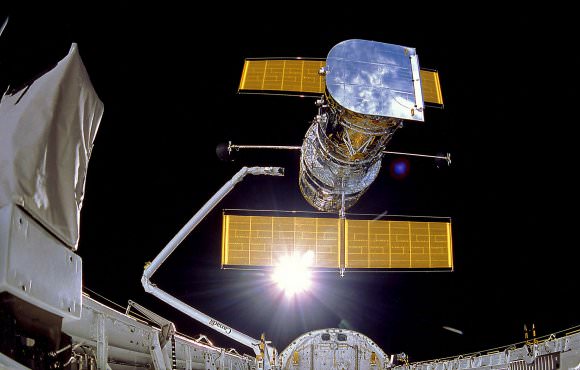 The Hubble Space Telescope could be considered the first of the Super Telescopes. In this image it is being released from the cargo bay of the Space Shuttle Discovery in 1990. Image: By NASA/IMAX - http://mix.msfc.nasa.gov/abstracts.php?p=1711, Public Domain, https://commons.wikimedia.org/w/index.php?curid=6061254
