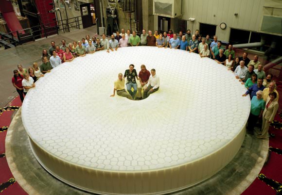 A group photo of the team behind the Large Synoptic Survey Telescope. The group gathered to celebrate the casting of the 'scope's 27.5 ft diameter mirror. The LSST will create a living, detailed, dynamic map of the sky and make it available to anyone. Image: LSST Corporation