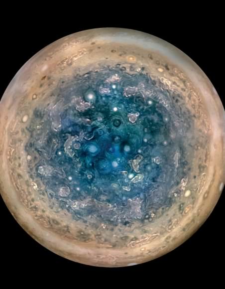 The tightly clustered storms that crowd Jupiter's polar regions are another of the gas giant's mysteries. In this image, cyclones the size of Earth bump up against each other at the south pole. Image:  NASA/JPL-Caltech/SwRI/MSSS/Betsy Asher Hall/Gervasio Robles