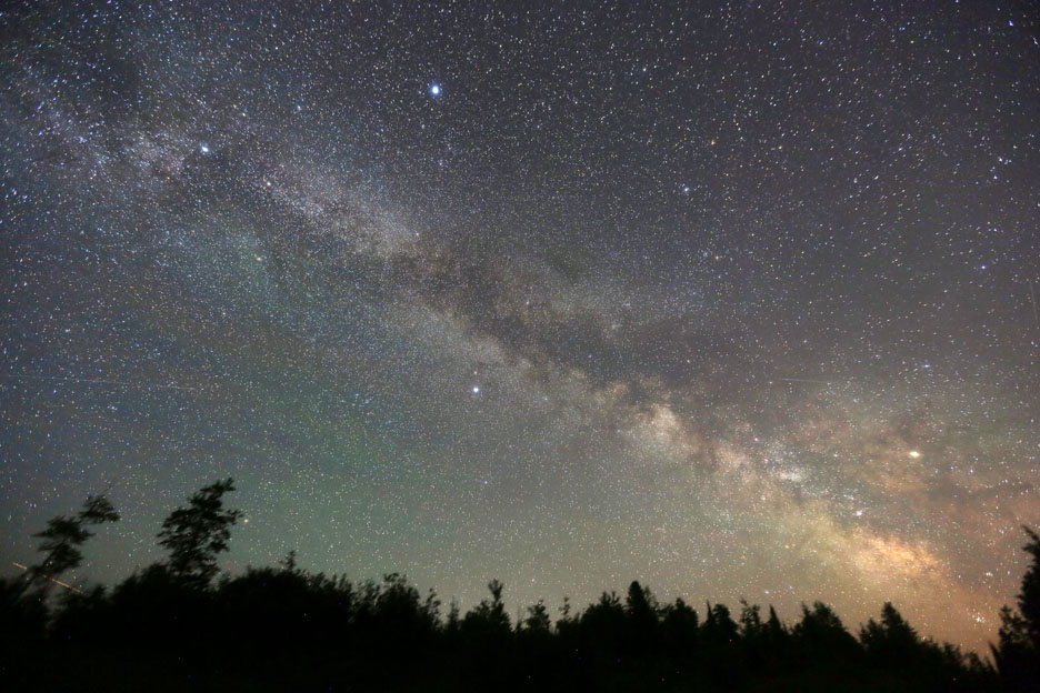 The band of light (the Milky Way) that is visible in the night sky shows the stellar disk of our galaxy. Credit: Bob King