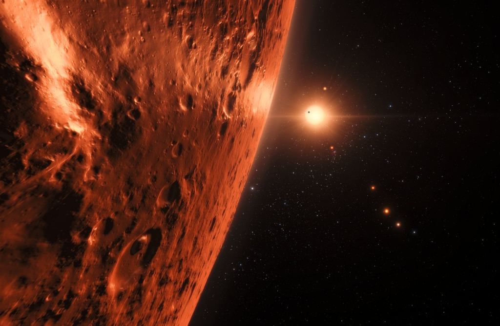 This artist’s impression shows the view from the surface of one of the planets in the TRAPPIST-1 system. A powerful laser beacon using current and near-future technology could send a signal strong enough to be detected by any alien astronomers here.  Credit: NASA/ESA/HST