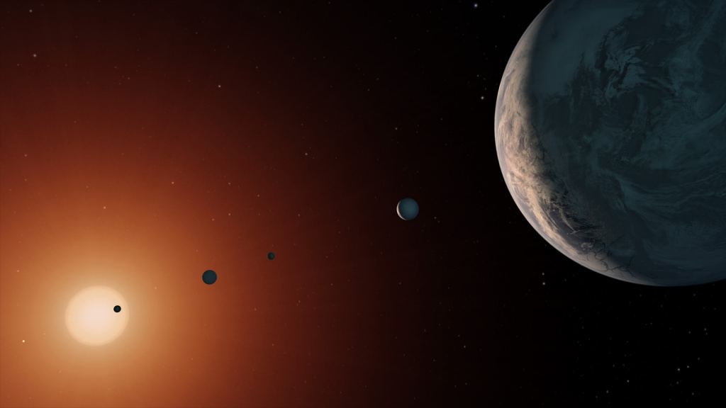 Most exoplanets orbit red dwarf stars because they're the most plentiful stars. This is an artist's illustration of what the TRAPPIST-1 system might look like from a vantage point near planet TRAPPIST-1f (at right). Credits: NASA/JPL-Caltech