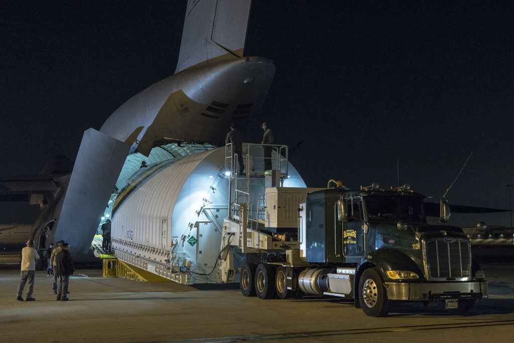 The Space Telescope for Air, Road, and Sea (STTARS) is a custom-designed container that holds the James Webb's Optical Telescope and Integrated Science (OTIS) instrument module. In this image its being unloaded from a U.S. military C-5 Charlie aircraft at Los Angeles International Airport (LAX) on Feb. 2, 2018. Image: NASA/Chris Gunn