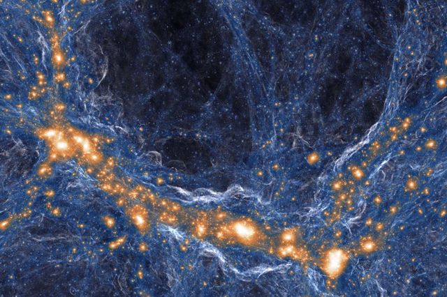 A computer simulation of the distribution of matter in the universe. Orange regions host galaxies; blue structures are gas and dark matter. Credit: TNG Collaboration