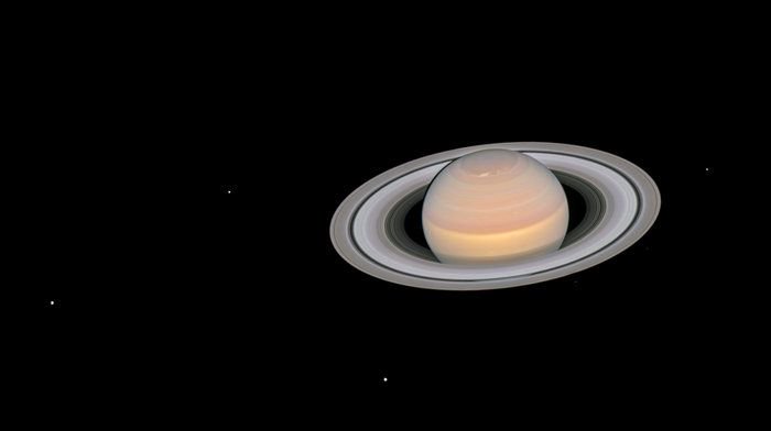 This image of Saturn shows the planet and some of its moons in opposition. It's a composite image taken by the Hubble on June 6th, 2018. Image: NASA, ESA, A. Simon (GSFC) and the OPAL Team, and J. DePasquale (STScI); CC BY 4.0