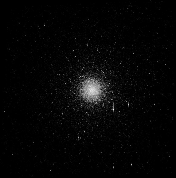 The globular star cluster Messier 54 is at the center of the Sagittarius dwarf galaxy. A galactic collision between Sagittarius and the Milky Way caused a ripple effect in the Milky Way's disc. Image: Public Domain Hubble Image.