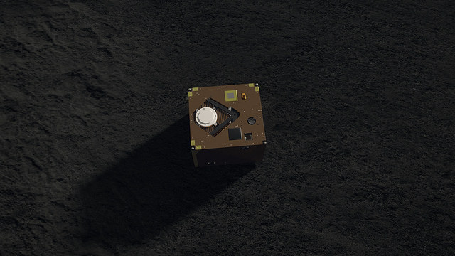 An artist's illustration of MASCOT, the little hopping robot, on the surface of asteroid Ryugu. Image Credit: DLR (CC-BY 3.0)