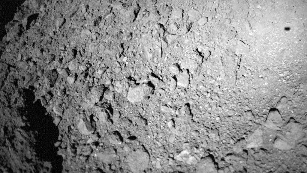The Mobile Asteroid Surface Scout (MASCOT) snapped this photo of the asteroid Ryugu during descent. The little hopping robot completed its brief mission and successfully transmitted all of its data back to Hayabusa2. Image: German Aerospace Center (CLR).