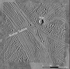 A higher-resolution Galileo image of Ganymede overlayed on a grainier Voyager image. The strike fault Kishar Sulcus is labelled. It intersects another feature called Tiamat Sulcus, running across Kishar Sulcus.  Image Credit: NASA, Cameron et al. 2018