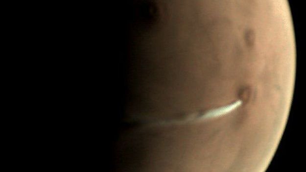 A funny cloud on Mars. The ESA' Mars Express orbiter captured this image of an elongated cloud forming near the Arsia Mons volcano at the Martian equator. Image: ESA/Mars Express