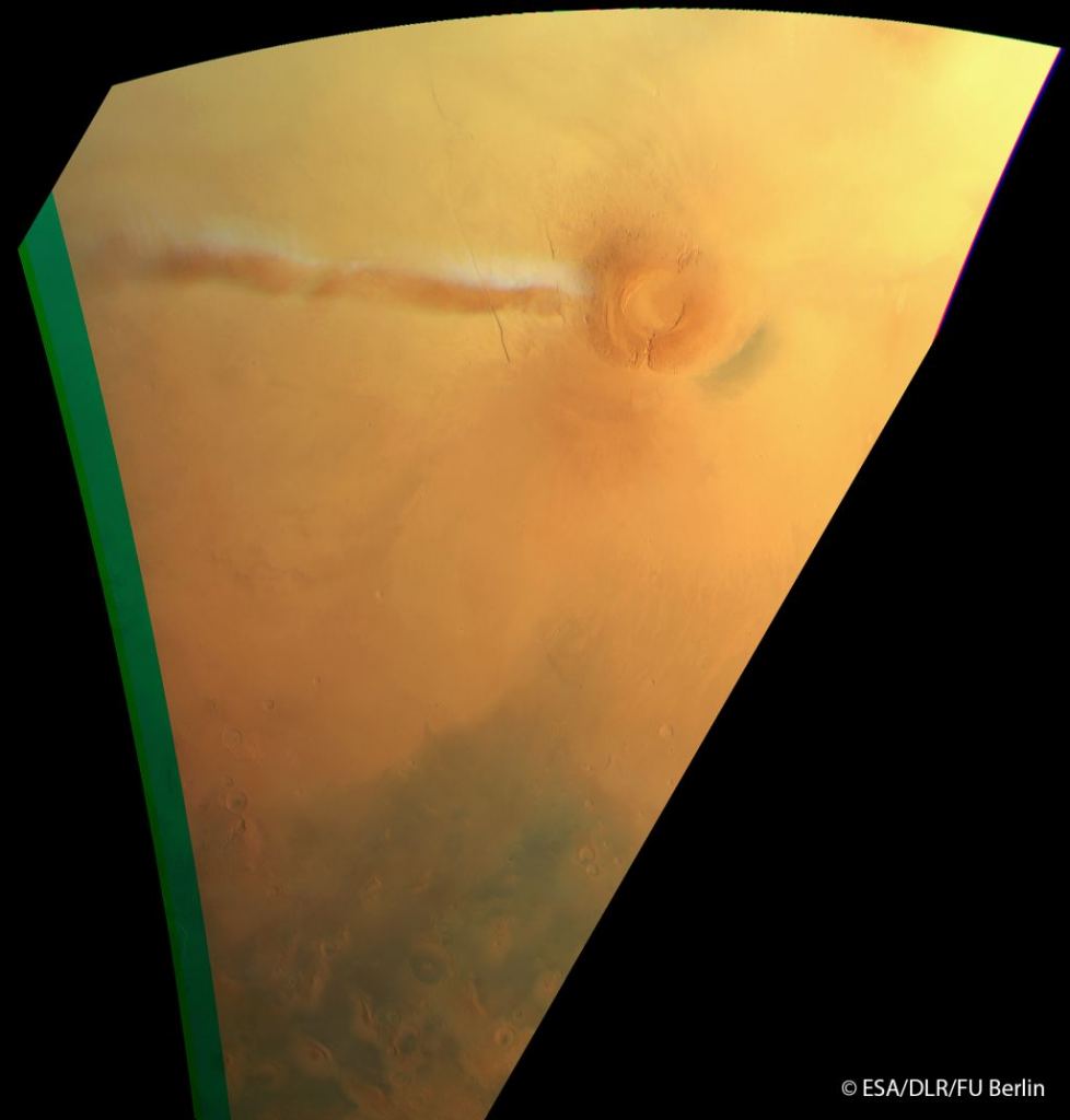 The High Resolution Stereo Camera on board ESA’s Mars Express snapped a view of a funny cloud on Mars that appears regularly in the vicinity of the Arsia Mons volcano. This water ice cloud, which arises as the volcano slope interacts with the air flow, can be seen as the long white feature extending to the lower right of the volcano. The cloud, which measures 915 km in this view, also casts a shadow on the surface. This image was taken on 21 September 2018 from an altitude of about 6930 km. North is up. Image Credit: ESA/DLR/FU Berlin http://www.esa.int/spaceinimages/ESA_Multimedia/Copyright_Notice_Images