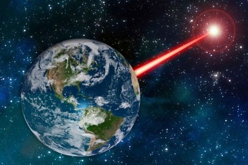 Some scientists have wondered if we should build a powerful laser to advertise our presence to any other civilizations out there. If other civilizations have done the same, then LUVOIR has a chance of detecting these technosignatures. Image: MIT News