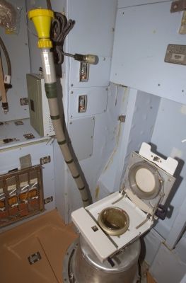 The toilet onboard the ISS. Image: NASA