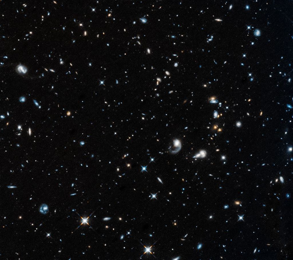 The image of the first Hubble after returning to service is a field of galaxies in the constellation Pegasus. Image Credit: NASA, ESA and A. Shapley (UCLA)