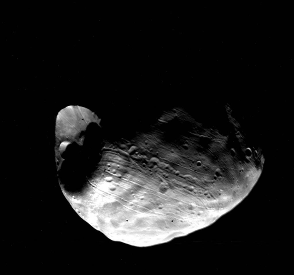 The Viking 1 orbiter captured this image of Phobos in 1977. The Stickney crater is on the left, and the mysterious grooves can be seen running horizontally. Image: NASA Goddard Space Flight Center.
