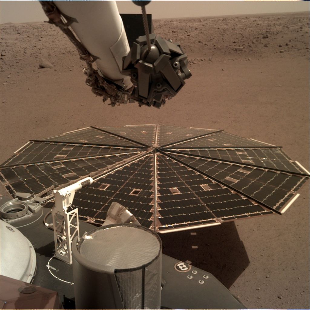 One of two Mars InSight's 7-foot (2.2 meters) wide solar panels was imaged by the lander's Instrument Deployment Camera, which is fixed to the elbow of its robotic arm. Accumulated dust on the panels has reduced the power available to the mission. Credits: NASA/JPL-Caltech